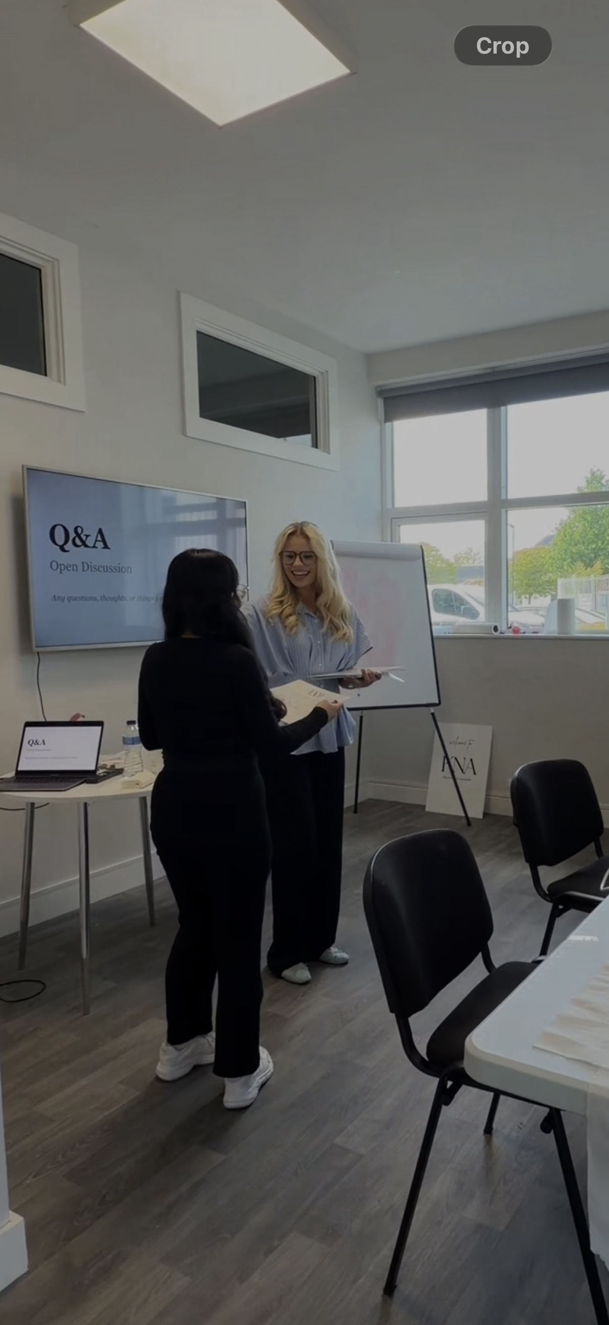 Kelly working through a question with a student